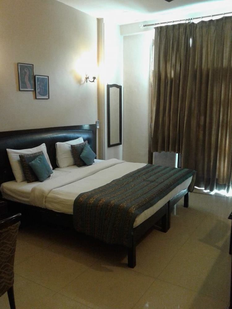 होटल Fabhotel Happy Residency